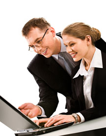 Business man & woman with wireless laptop